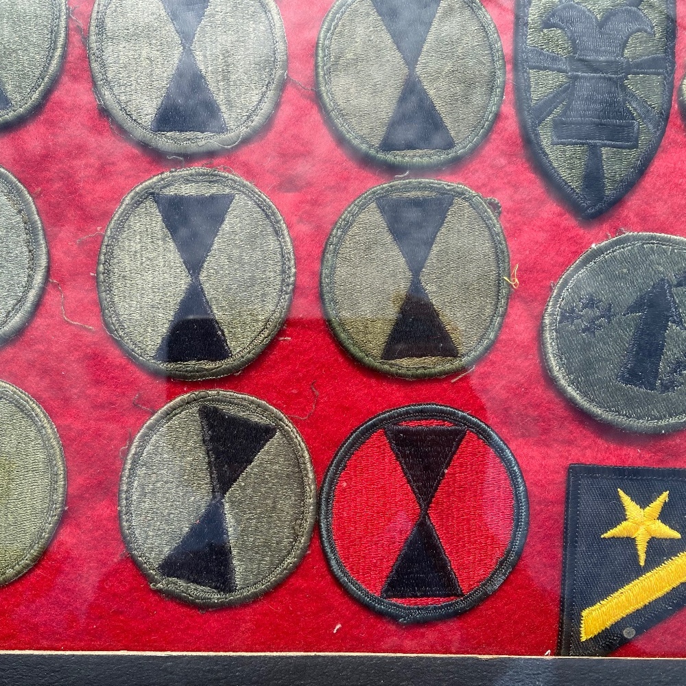 Vintage tray of military patches.